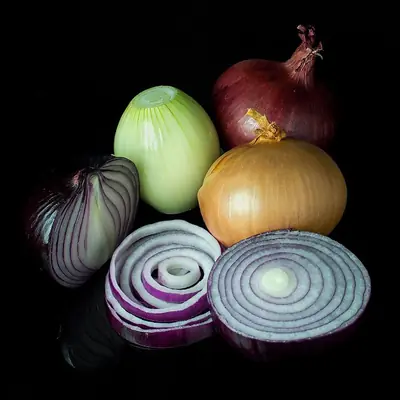 Red, white and brown onions, some sliced into rings